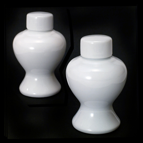 White lidded ceramic vessel.