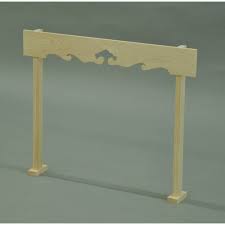 A freestanding wooden kumoita whose top bar is shaped like an abstract cloud. It stands on two pillars.